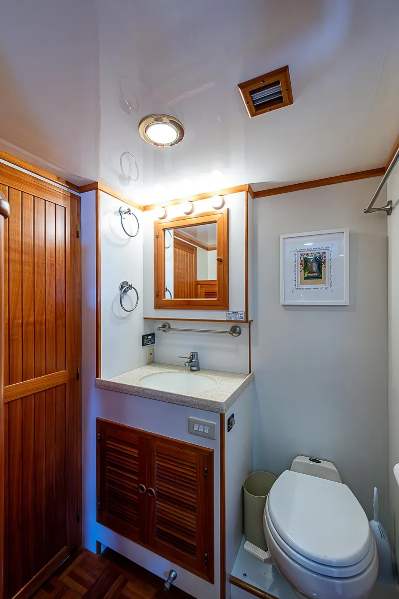 Slide: The Image of Kadey-Krogen 58 yacht bathroom, 2001 model, featuring wood accents and modern fixtures. - 41