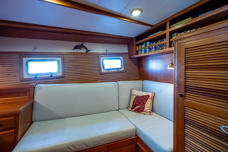 Slide: The Image of Luxurious 2001 Kadey-Krogen 58 yacht interior with cozy seating and elegant wood paneling. - 43
