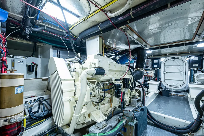 Slide: The Image of Engine room of 2001 Kadey-Krogen 58 yacht, showcasing machinery and equipment. - 49