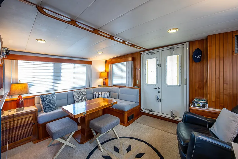 Slide: The Image of Luxurious interior of 2001 Kadey-Krogen 58 yacht with elegant seating and wooden accents. - 5