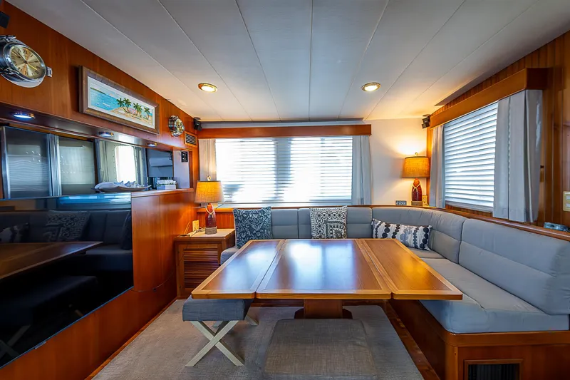 Slide: The Image of Luxurious interior of 2001 Kadey-Krogen 58 yacht with elegant dining area and cozy seating. - 8