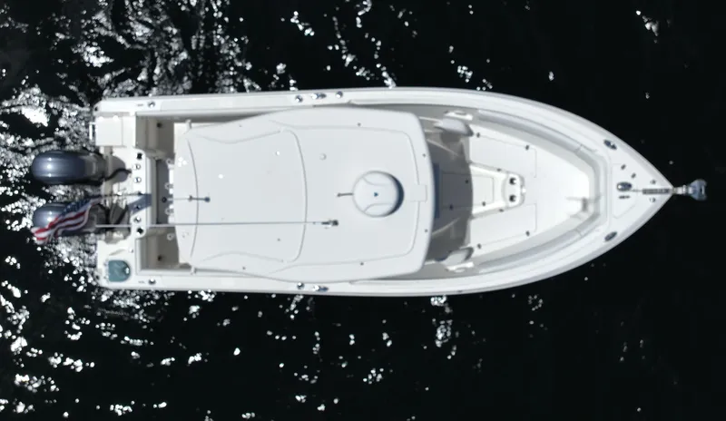 Slide: The Image of 2016 Sailfish 270 CC boat, aerial view, on dark water. - 15