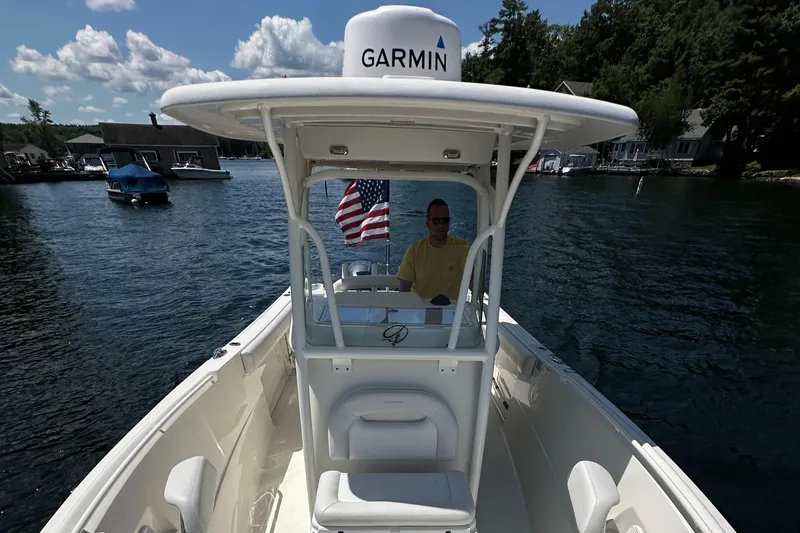 Slide: The Image of 2016 Sailfish 270 CC boat on a lake with Garmin equipment. - 26