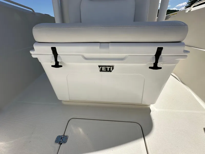 Slide: The Image of 2016 Sailfish 270 CC boat with Yeti cooler under seat. - 30