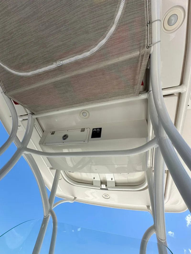 Slide: The Image of 2016 Sailfish 270 CC boat overhead console and storage. - 31