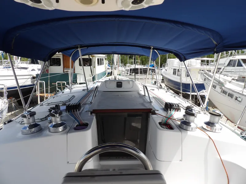 Slide: The Image of Cockpit view of 2000 Hunter 460 sailboat docked at marina. - 14