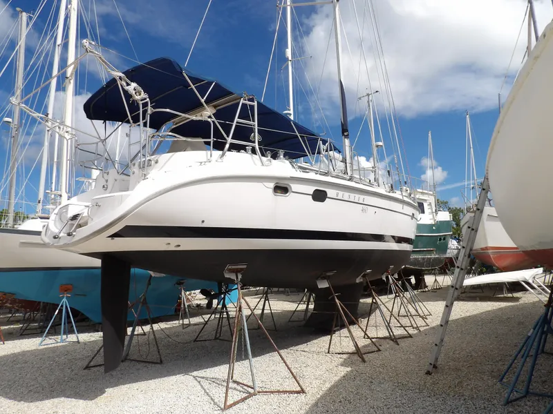 Slide: The Image of Hunter 460 sailboat, 2000 model, on dry dock with blue sky background. - 2