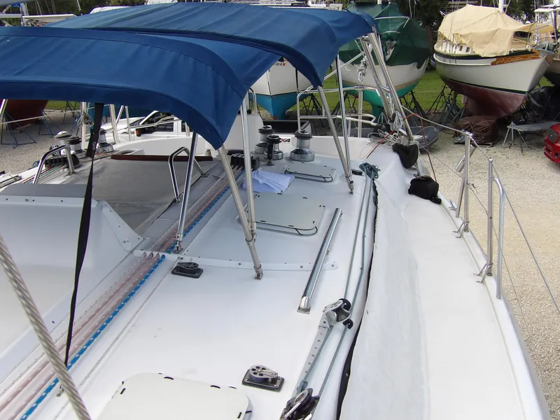 Slide: The Image of Hunter 460 sailboat, 2000 model, with blue canopy and deck equipment. - 21