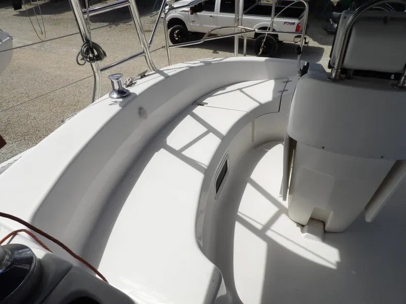 Slide: The Image of Hunter 460 sailboat cockpit, 2000 model, clean white seating area. - 23