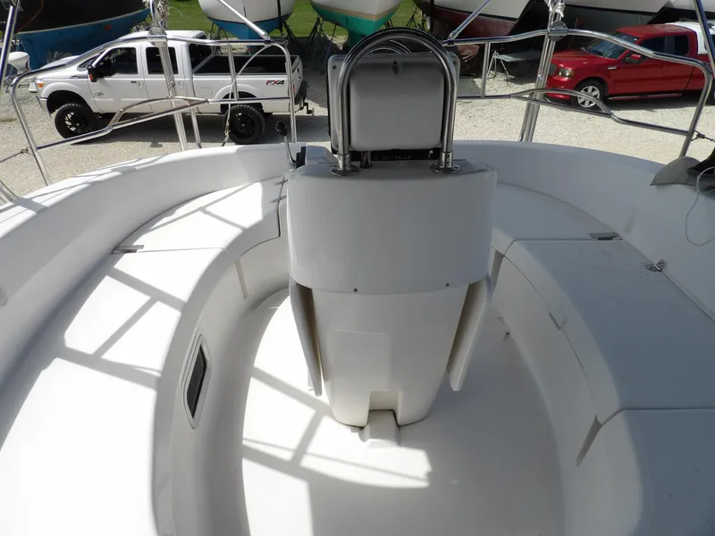 Slide: The Image of Cockpit of 2000 Hunter 460 sailboat with steering wheel and seating area. - 24