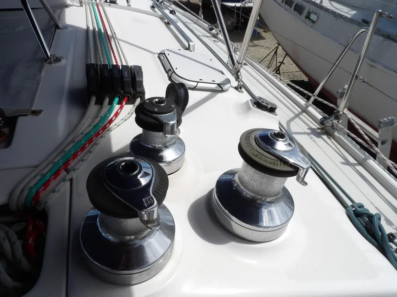 Slide: The Image of Deck of 2000 Hunter 460 sailboat with winches and ropes. - 32