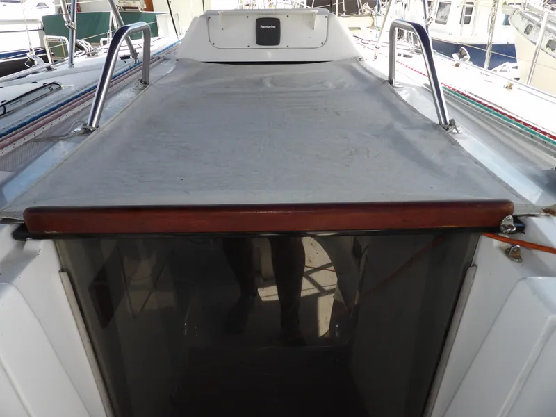 Slide: The Image of Hunter 460 sailboat cockpit with cover, 2000 model, docked in marina. - 34