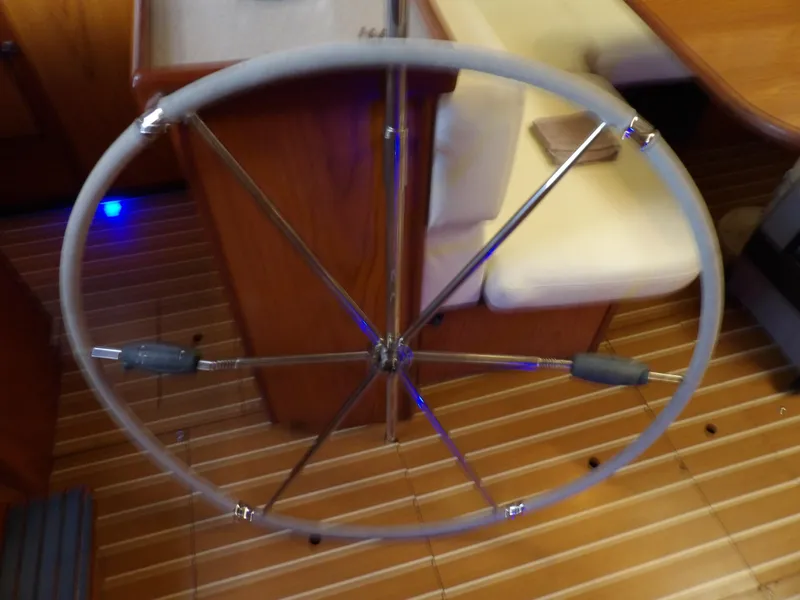 Slide: The Image of Steering wheel of a 2000 Hunter 460 sailboat, wooden interior. - 36