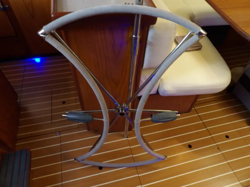 Slide: The Image of Steering wheel of a 2000 Hunter 460 sailboat in the cabin. - 37
