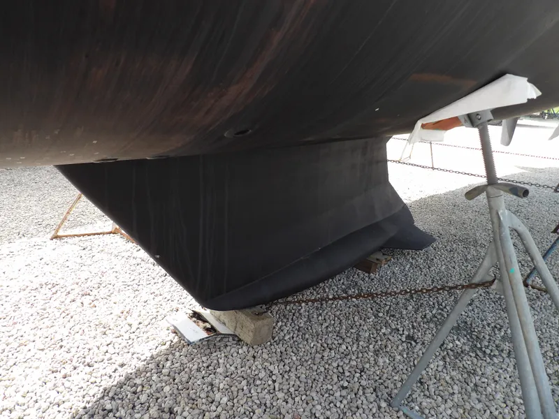 Slide: The Image of Hunter 460 sailboat keel, 2000 model, on dry dock for maintenance. - 6