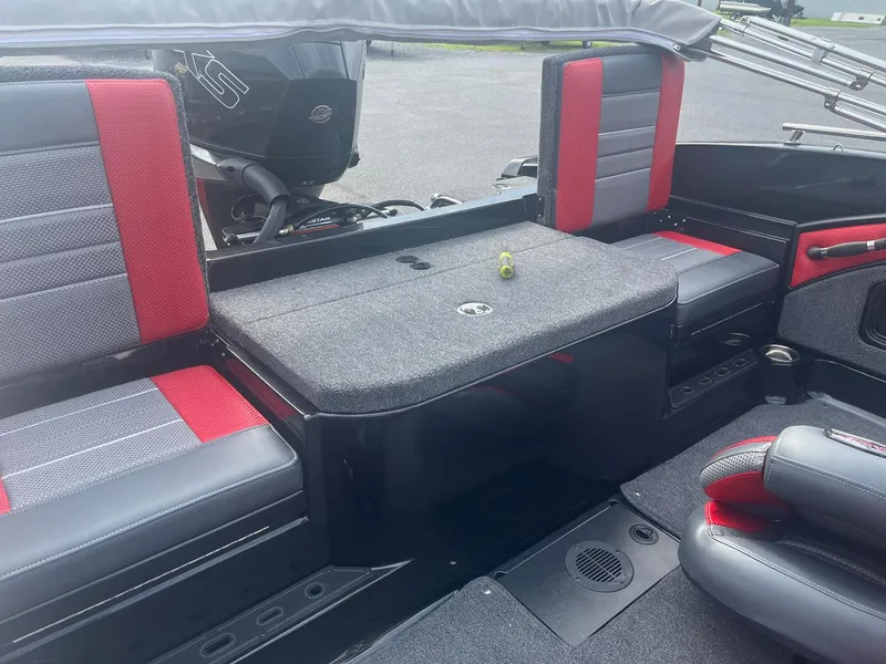Slide: The Image of 2025 Ranger 1880MS boat interior with red and gray seating and storage compartments. - 4