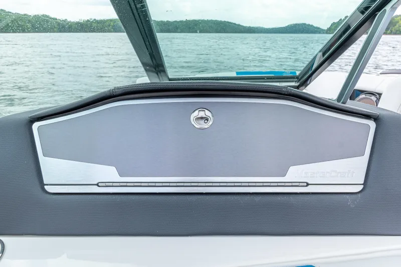 Slide: The Image of 2019 MasterCraft X24 dashboard on a lake, featuring sleek design and modern controls. - 14
