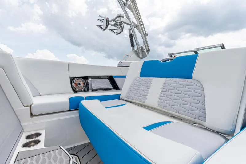 Slide: The Image of 2019 MasterCraft X24 boat interior with blue and white seating, featuring modern design elements. - 21