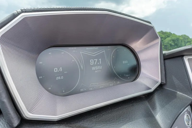 Slide: The Image of 2019 MasterCraft X24 dashboard displaying radio station 97.1 WSRV. - 26