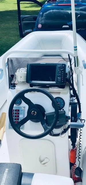 Slide: The Image of 2004 AB Inflatables Oceanus 4.30VST boat console with steering wheel and navigation equipment. - 3