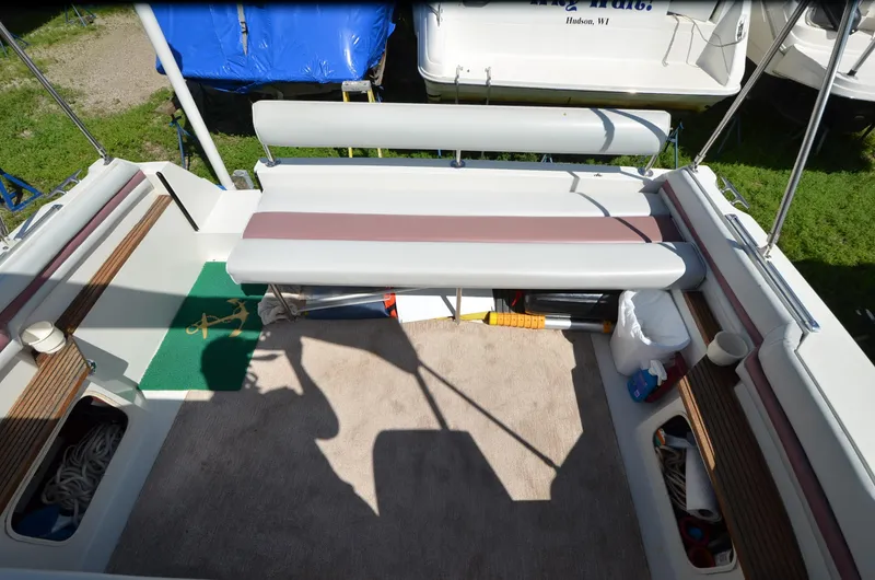 Slide: The Image of 1988 Carver 27 Montego boat interior with seating and storage compartments. - 12