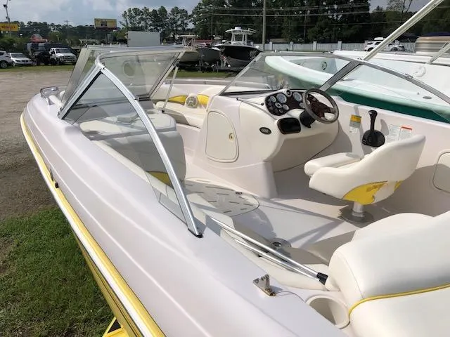 Slide: The Image of 2005 Tahoe Q4 I/O boat interior with steering wheel and seating. - 10