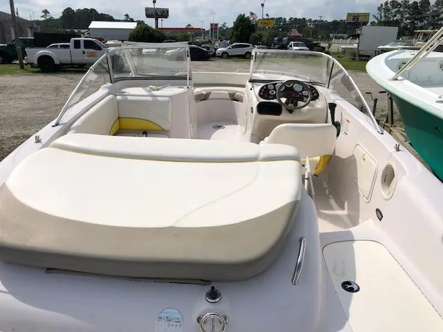 Slide: The Image of 2005 Tahoe Q4 I/O boat interior with seating and steering console. - 11