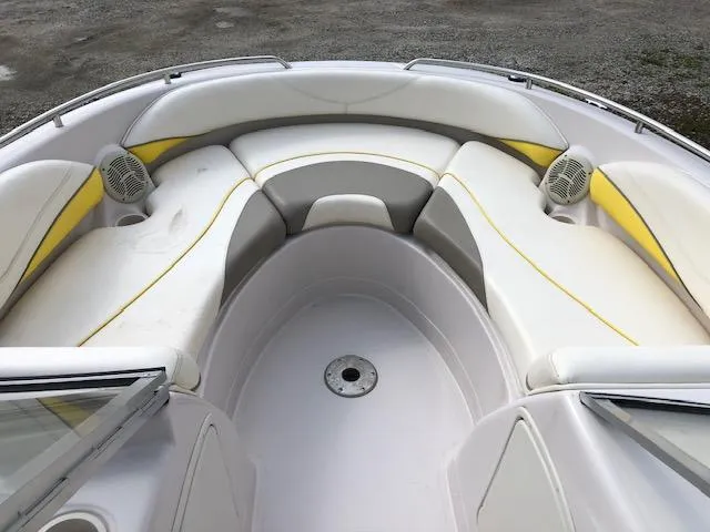 Slide: The Image of 2005 Tahoe Q4 I/O boat interior with white and yellow cushioned seating. - 15