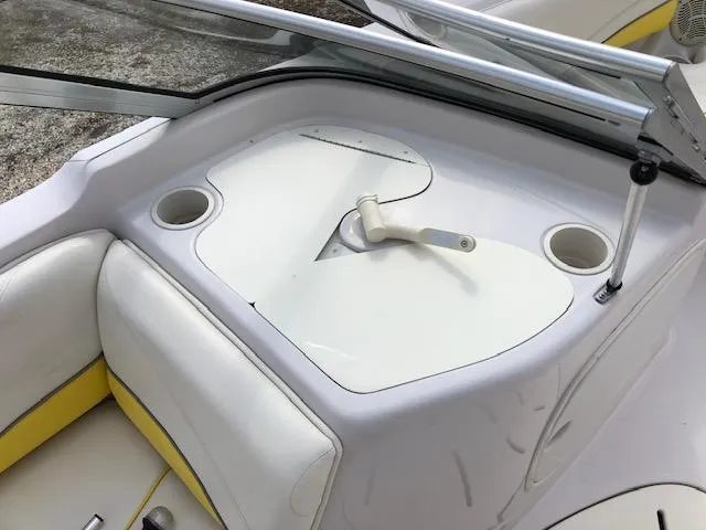 Slide: The Image of 2005 Tahoe Q4 I/O boat interior with white and yellow seating. - 16