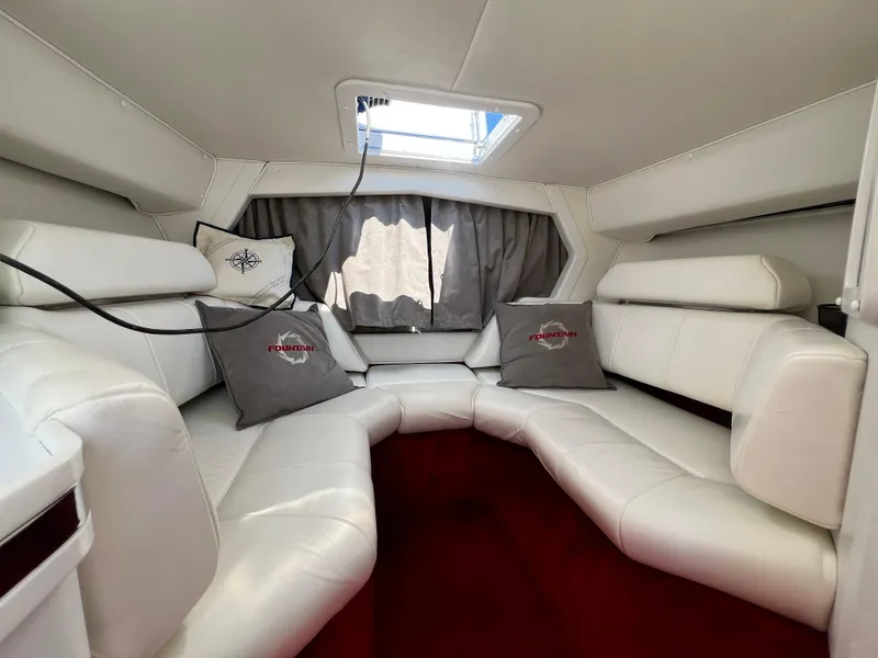 Slide: The Image of Interior of 2001 Fountain Lightning Executioner 35 boat with white leather seating. - 14