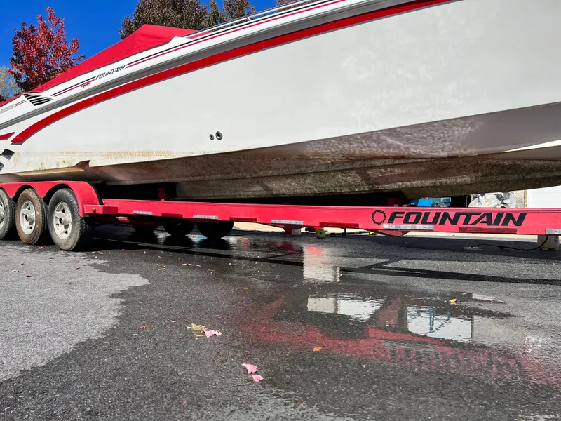 Slide: The Image of 2001 Fountain Lightning Executioner 35 boat on a red trailer. - 17