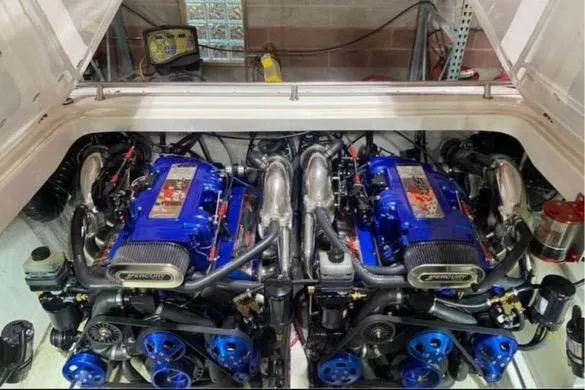 Slide: The Image of 2001 Fountain Lightning Executioner 35 twin engines in engine compartment. - 21