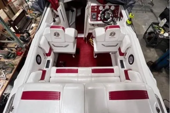 Slide: The Image of 2001 Fountain Lightning Executioner 35 boat interior with red and white seating. - 25
