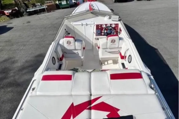 Slide: The Image of 2001 Fountain Lightning Executioner 35 boat interior with white and red seating. - 26