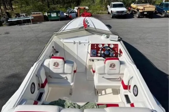 Slide: The Image of 2001 Fountain Lightning Executioner 35 boat interior with white and red seating. - 27