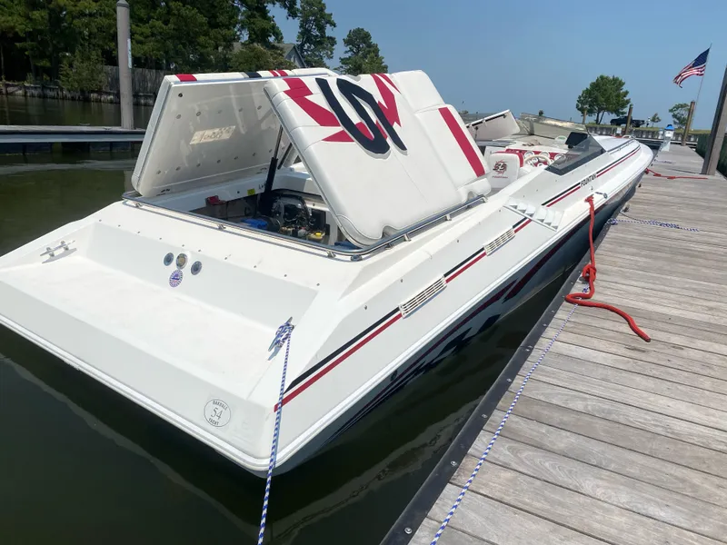Slide: The Image of 2001 Fountain Lightning Executioner 35 speedboat docked, rear view. - 5