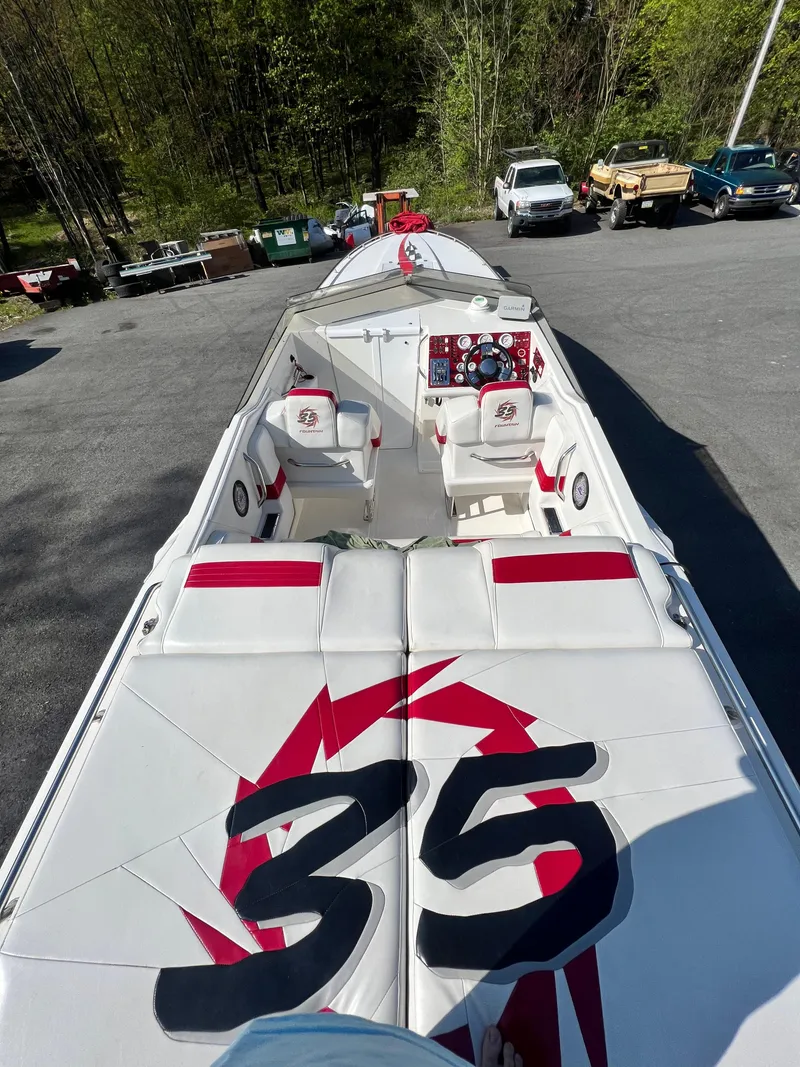 Slide: The Image of 2001 Fountain Lightning Executioner 35 speedboat with white and red interior. - 9