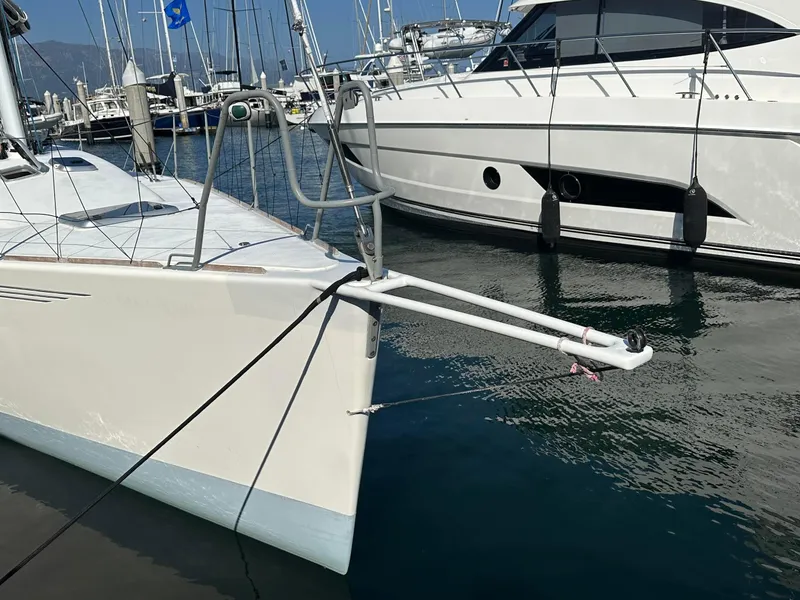 Slide: The Image of Sailboat X-Yachts IMX40 (2001) docked in marina, adjacent to motor yacht. - 5