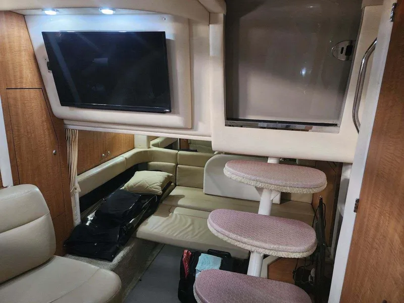 Slide: The Image of Interior of 2006 Sea Ray 340 Sundancer with TV, seating, and steps. - 10