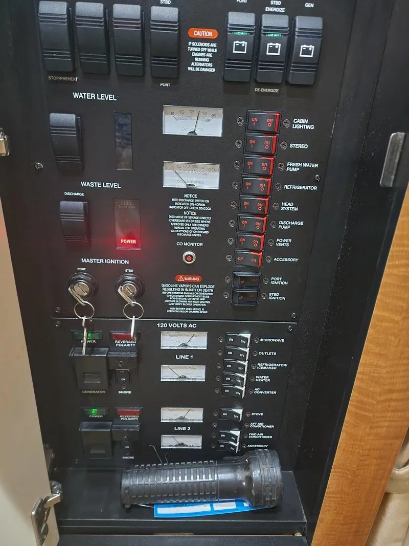 Slide: The Image of Electrical control panel of a 2006 Sea Ray 340 Sundancer boat. - 13