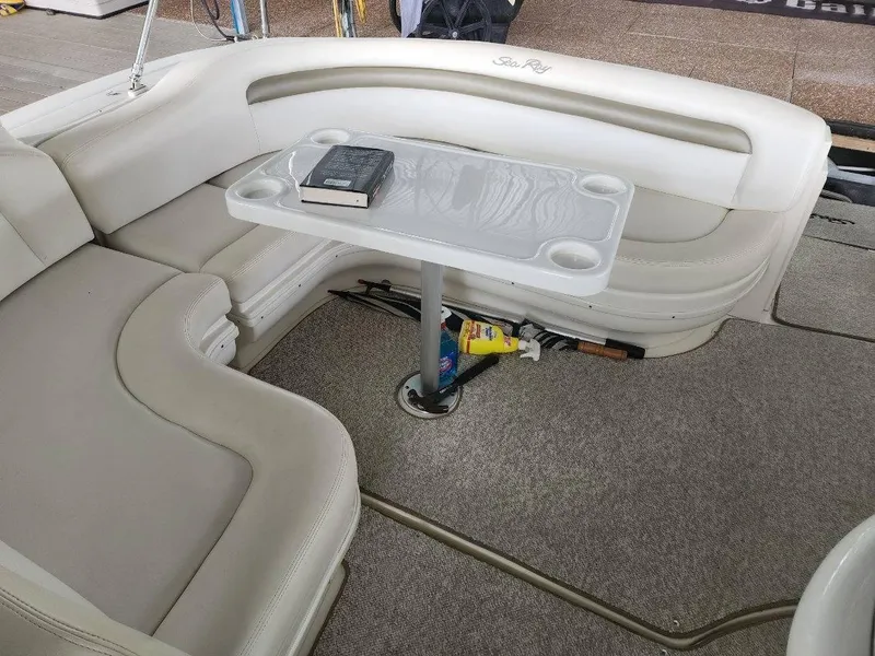 Slide: The Image of 2006 Sea Ray 340 Sundancer interior with white leather seating and table. - 15