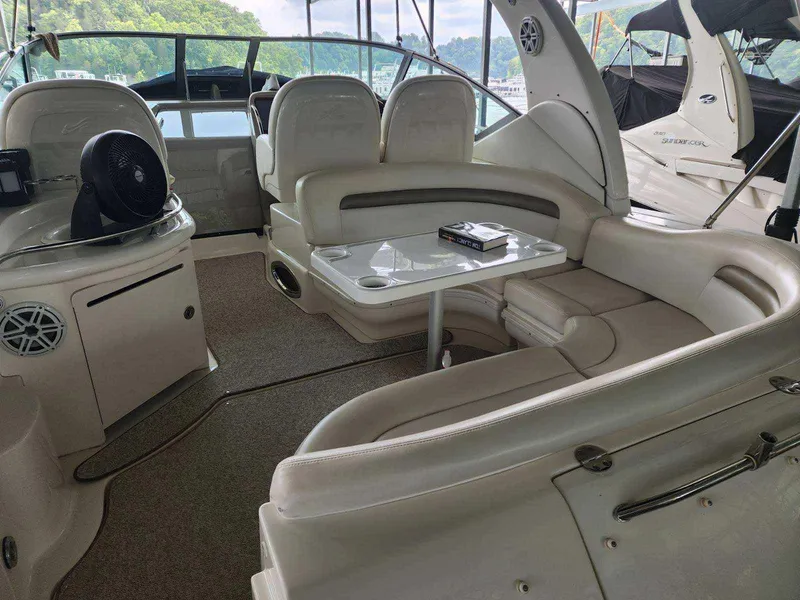 Slide: The Image of Interior of 2006 Sea Ray 340 Sundancer yacht with white leather seating and table. - 16