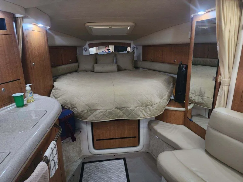 Slide: The Image of Interior cabin of a 2006 Sea Ray 340 Sundancer yacht with bed and seating area. - 8