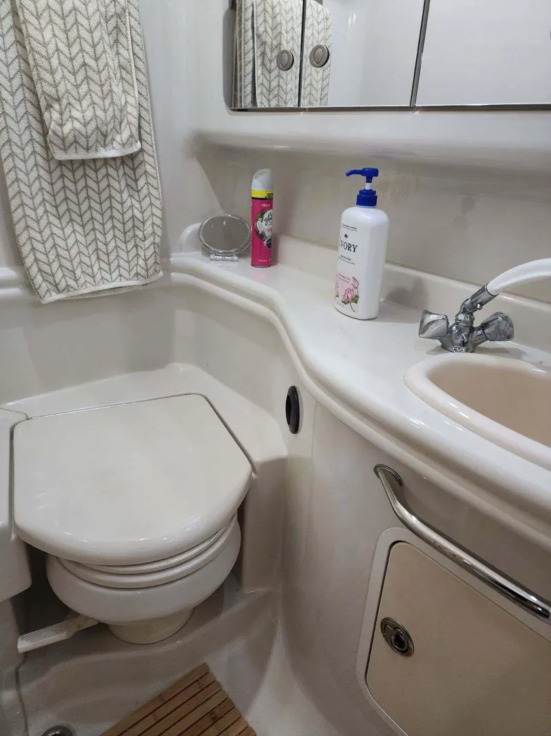 Slide: The Image of Bathroom interior of 2006 Sea Ray 340 Sundancer yacht with sink and toilet. - 9