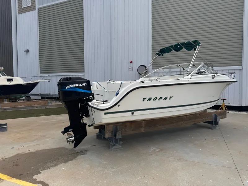 Slide: The Image of 2001 Trophy 1900 Dual Console boat with Mercury outboard motor on dry dock. - 2