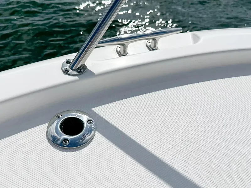 Slide: The Image of Close-up of 2020 Boston Whaler 325 Conquest boat deck with rod holder. - 12