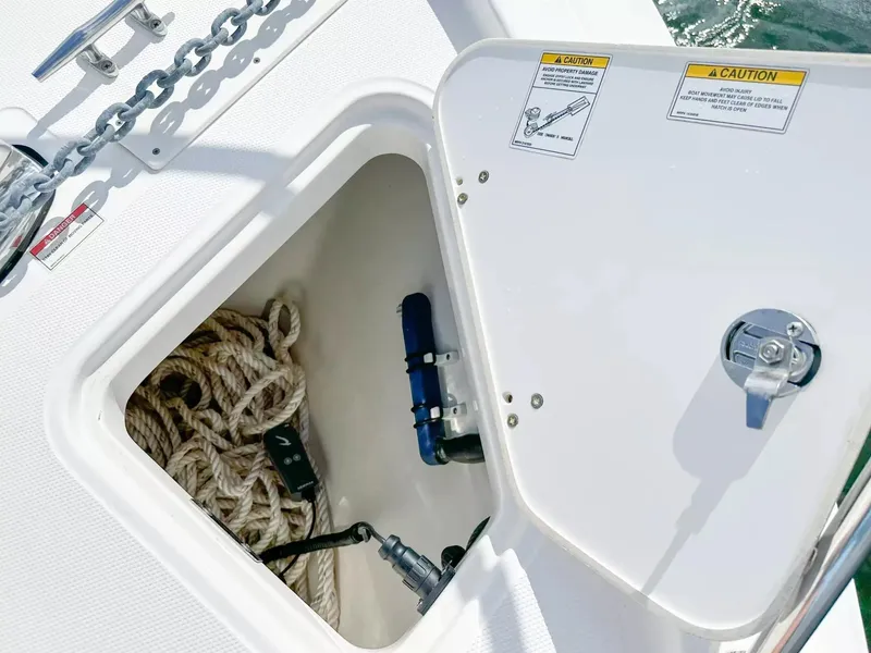 Slide: The Image of 2020 Boston Whaler 325 Conquest anchor locker with rope and chain. - 14
