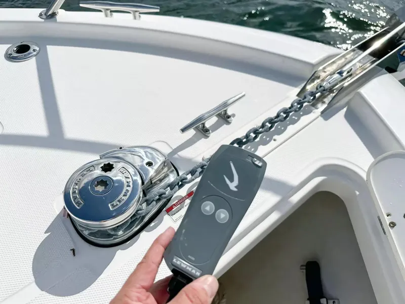 Slide: The Image of 2020 Boston Whaler 325 Conquest anchor windlass and remote control. - 15