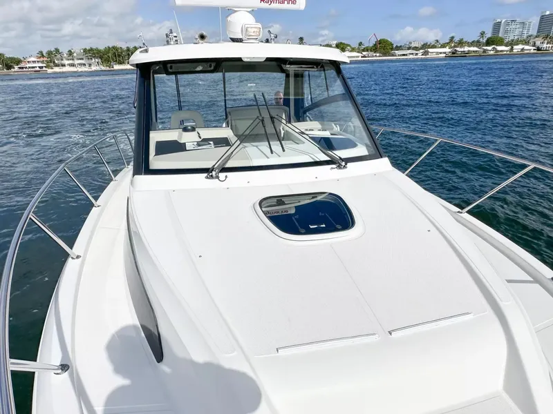 Slide: The Image of 2020 Boston Whaler 325 Conquest boat on the water, front deck view. - 18