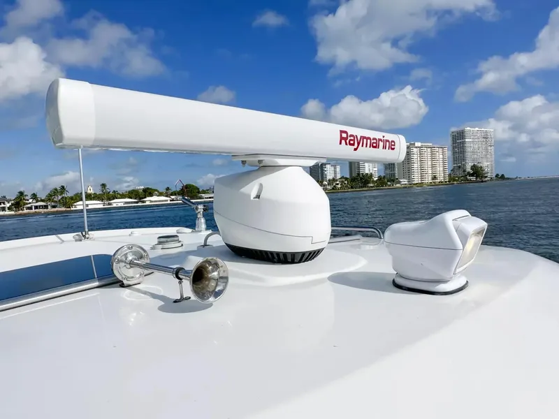 Slide: The Image of Close-up of 2020 Boston Whaler 325 Conquest radar and horn system on a sunny day. - 20